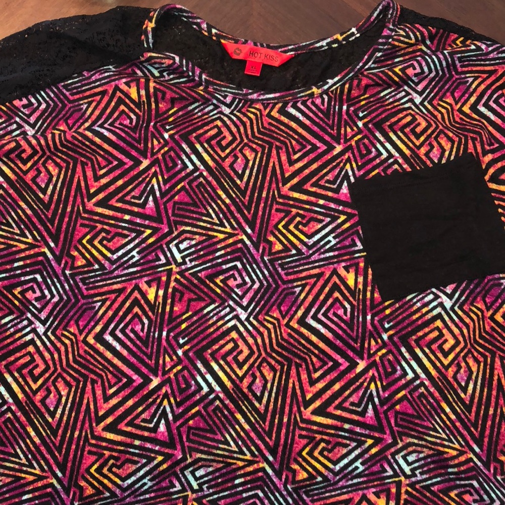 Cute top with vibrant colors and lace in back
